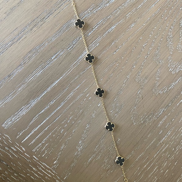 Elegant Black and Gold Clover Bracelet